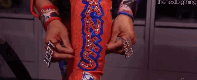 a woman is putting on a pair of knee pads that say boss on them