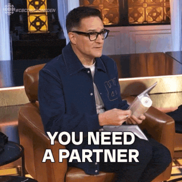 a man sitting in a chair with the words you need a partner on the bottom