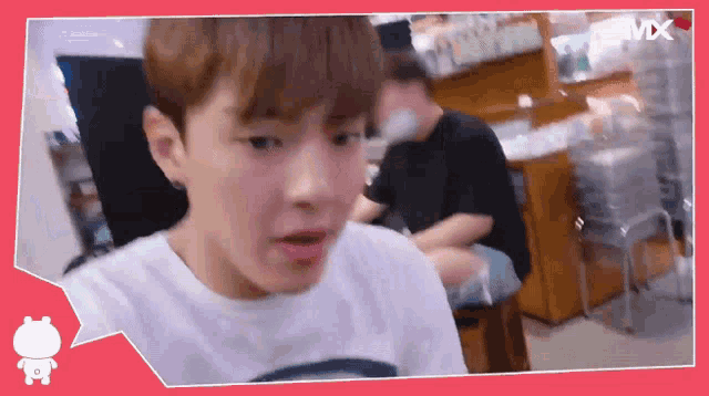 a man is sitting in a chair with a speech bubble that says mx