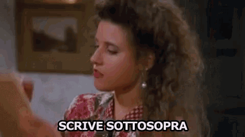 a woman is taking a picture of herself with a cell phone and the words scrive sotto sopra are written above her .
