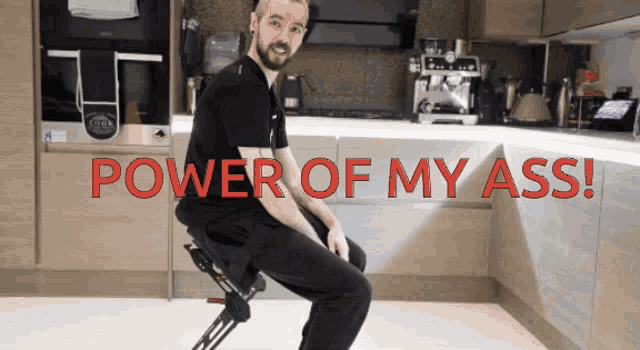 a man is sitting on a chair with the words power of my ass written in red