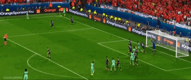 a soccer game is being played in front of a banner for energy of azerban