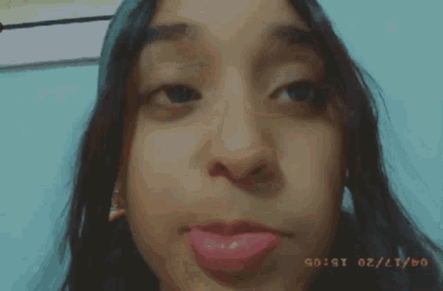a close up of a woman 's face with the date 04/20 on the bottom right