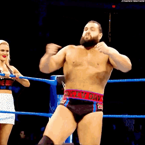 a shirtless wrestler in a wrestling ring with a belt that says rusty oak