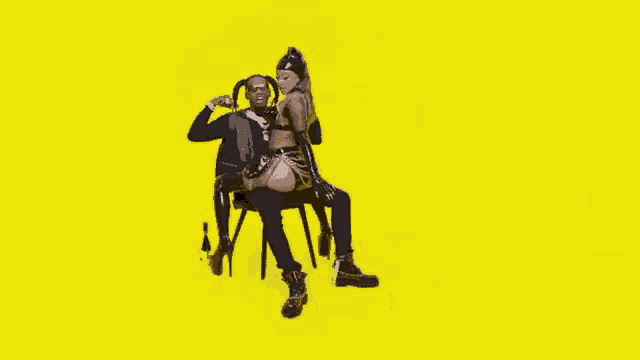 a man is sitting on a chair with a woman sitting on his lap on a yellow background .