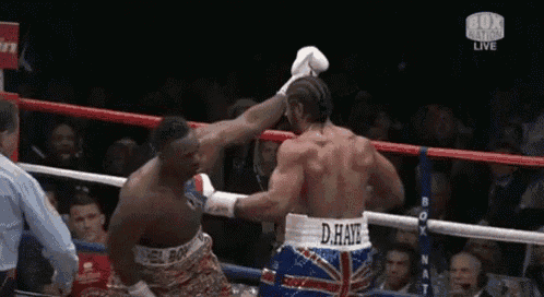 two boxers are fighting in a ring and one of them has the name d. haye on his shorts