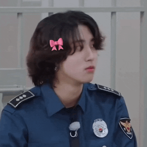 a police officer with a bow on his head