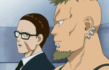 a man with a mohawk and a man with earrings on his ears