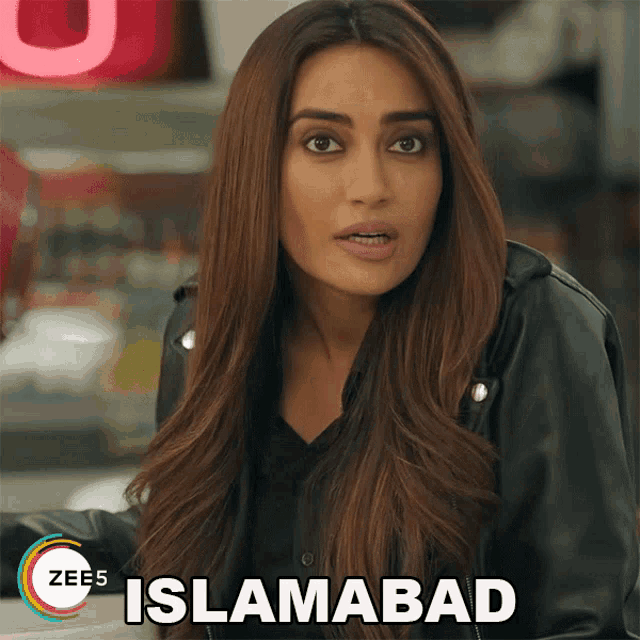 a woman in a black jacket with the word islamabad on the bottom right