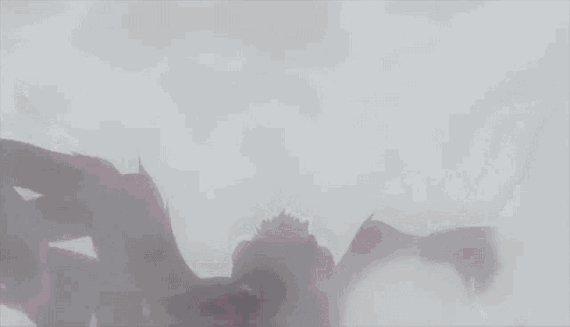 a spider with red arms and legs is crawling on a white background .