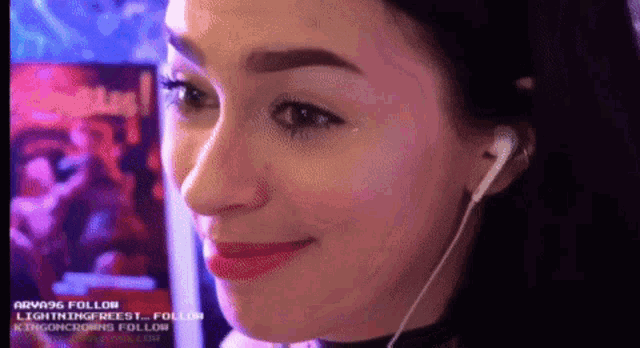 a close up of a woman 's face with the words arva96 follow visible