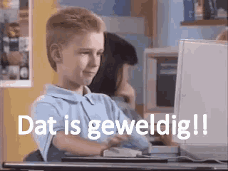 a young boy sitting in front of a computer with the words dat is geweldig written above him