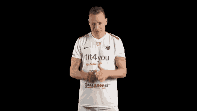 a man wearing a white shirt with the words fit4you on it