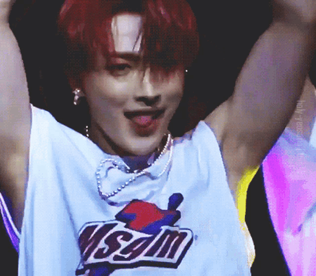 a young man with red hair is wearing a shirt that says visam on it