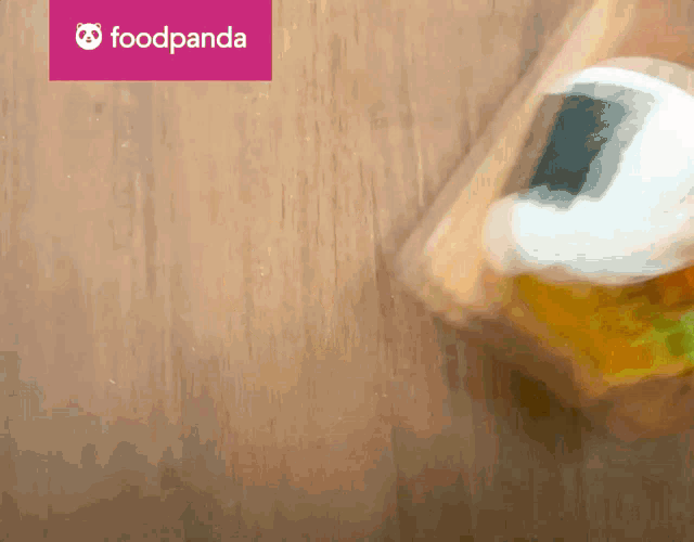 a blurred image of a food panda logo