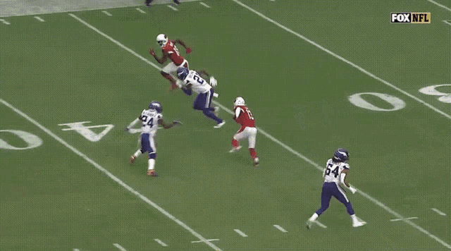 a football player with the number 10 on his jersey is running on the field