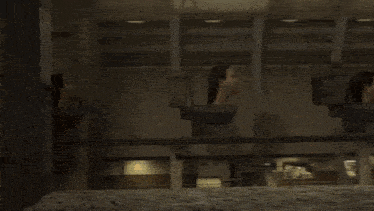 a man wearing a hard hat is working on a machine
