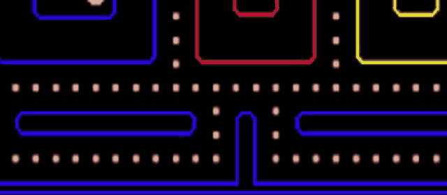 a baby is playing a video game with a pac man theme
