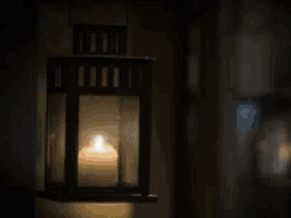 a lantern with a lit candle and the words good night written on it