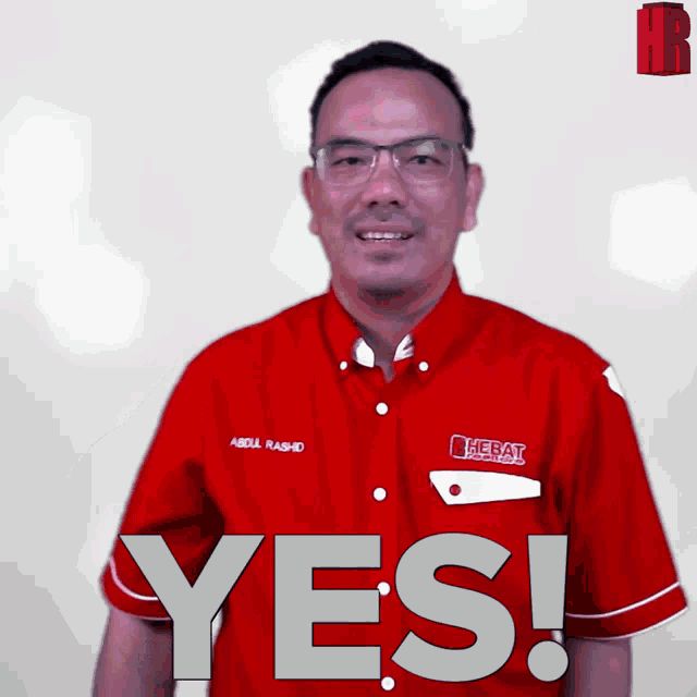 a man in a red shirt says yes