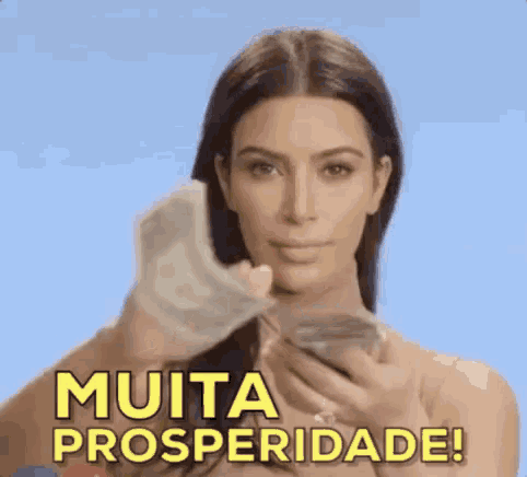 a woman is holding a bunch of money in her hand and giving it to someone .