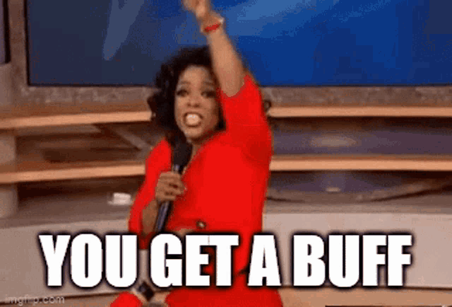 oprah winfrey is holding a microphone and saying `` you get a buff '' while sitting on a stage .