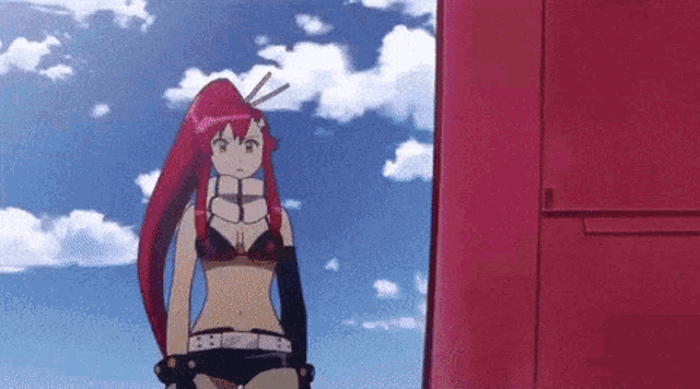 a girl with long red hair is standing in front of a red door