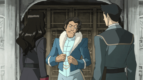 a man in a blue jacket with a fur collar is standing in front of two women