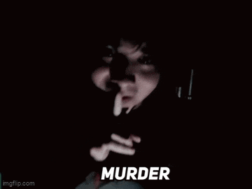 a close up of a person holding a gun in a dark room with the word murder written on the bottom .
