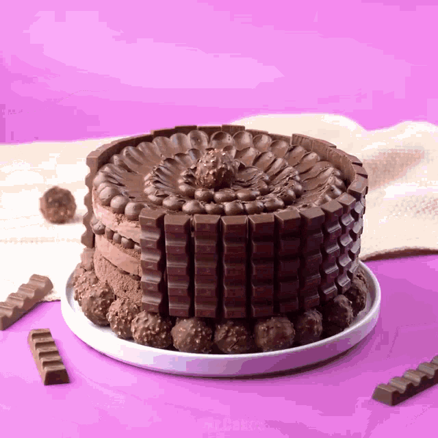 a cake made out of chocolate bars and nuts
