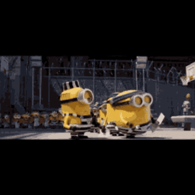 a group of minions are standing next to each other on the street