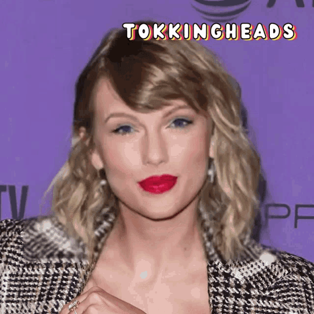 a close up of a woman 's face with the words tokingheads above her head
