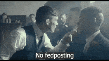 two men in suits are fighting in a room with the words no fedposting written on the bottom