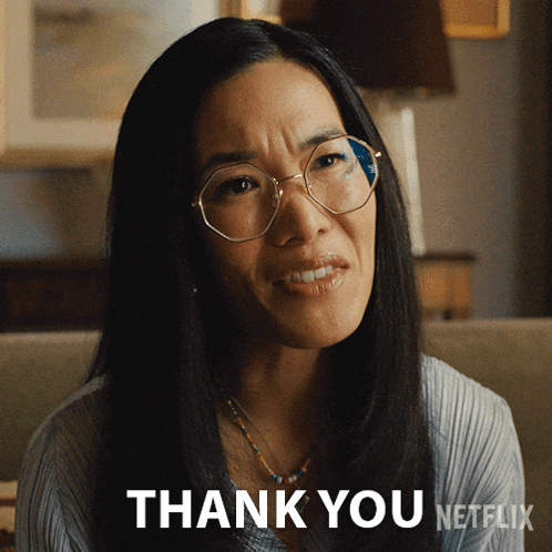 a woman wearing glasses says " thank you " in a netflix ad