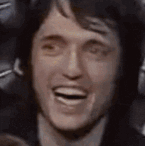 a close up of a man 's face with his mouth wide open