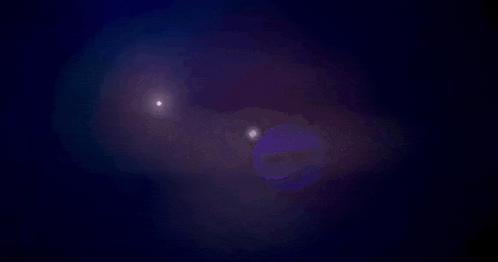 a purple and blue background with a glowing light in the middle
