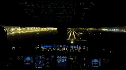 a blurred image of the cockpit of an airplane with the numbers 00 and 81 on the dashboard