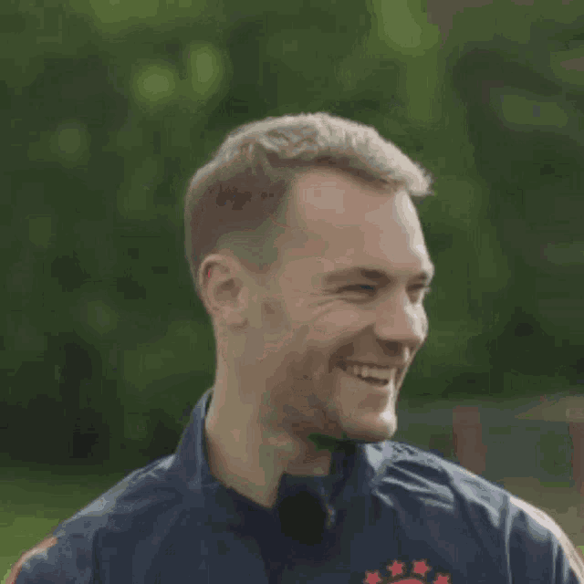 a man wearing a jacket that says adidas on it