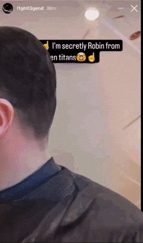 a screenshot of a man with a caption that says i 'm secretly robin from en titans