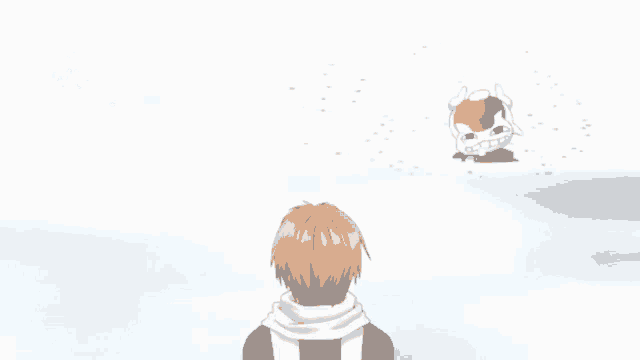 a man is standing in the snow looking at a cat with music notes on it 's head