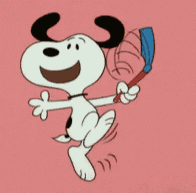 snoopy is holding a blue box in his hand and smiling .