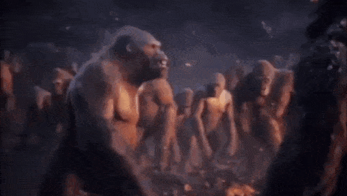 a close up of a gorilla 's face with flames behind it .