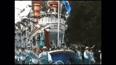 a parade with a boat that says s.r. disney