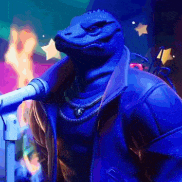 a lizard wearing a blue jacket is standing next to a microphone .
