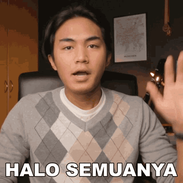 a man wearing a plaid sweater says halo semuanya