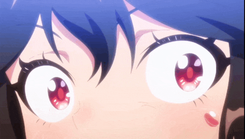 a close up of a girl 's eyes with a surprised expression