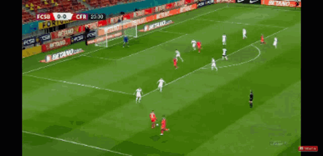 a soccer game is being played in a stadium with a betano banner