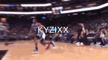 a blurry picture of a basketball game with the name kyzixx written on the bottom