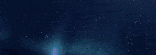 a close up of a blue haired anime girl in a dark room .