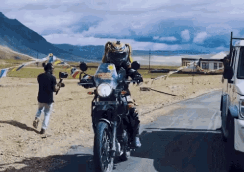 a person riding a motorcycle with a license plate that says lkc - jc - 003